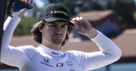 Colton Herta Indycar driver holding his racing cap