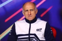 Tost sitting during a presser