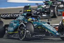 Green aston martin f1 car on track