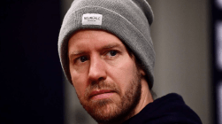Vettel looking forward wearing a grey hat