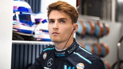 Racing driver, Sargeant, in team uniform.