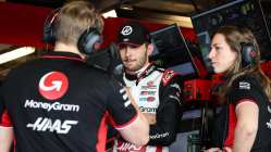 Ocon working his his race engineers in Haas F1 pit garage