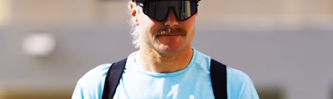 Bottas in cap and sunglasses, casual attire.