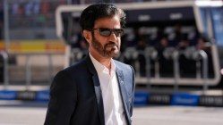 Sulayem walking in a formal outfit.