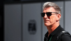 lowdon in black shirt walking confidently.