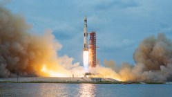 Rocket launching amidst billowing smoke