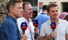 Sky Sports presenters holding microphones