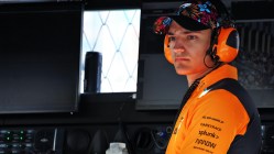 Palou, McLaren team member in vibrant attire.