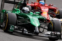 Caterham F1 car racing against Ferrari