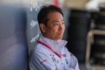 Man in Honda team jacket leaning