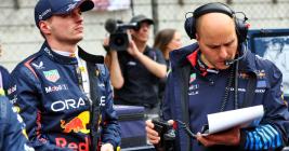 Max Verstappen in team pit area.