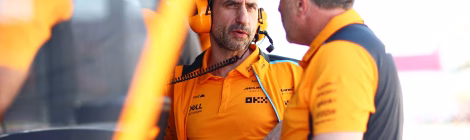 Stella and Brown of McLaren in orange team uniforms