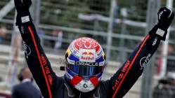 Verstappen wearing his race helmet raised arms as he wins Nürburgring on debut