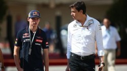 Max and Toto talk whilst walking through the Formula 1 paddock