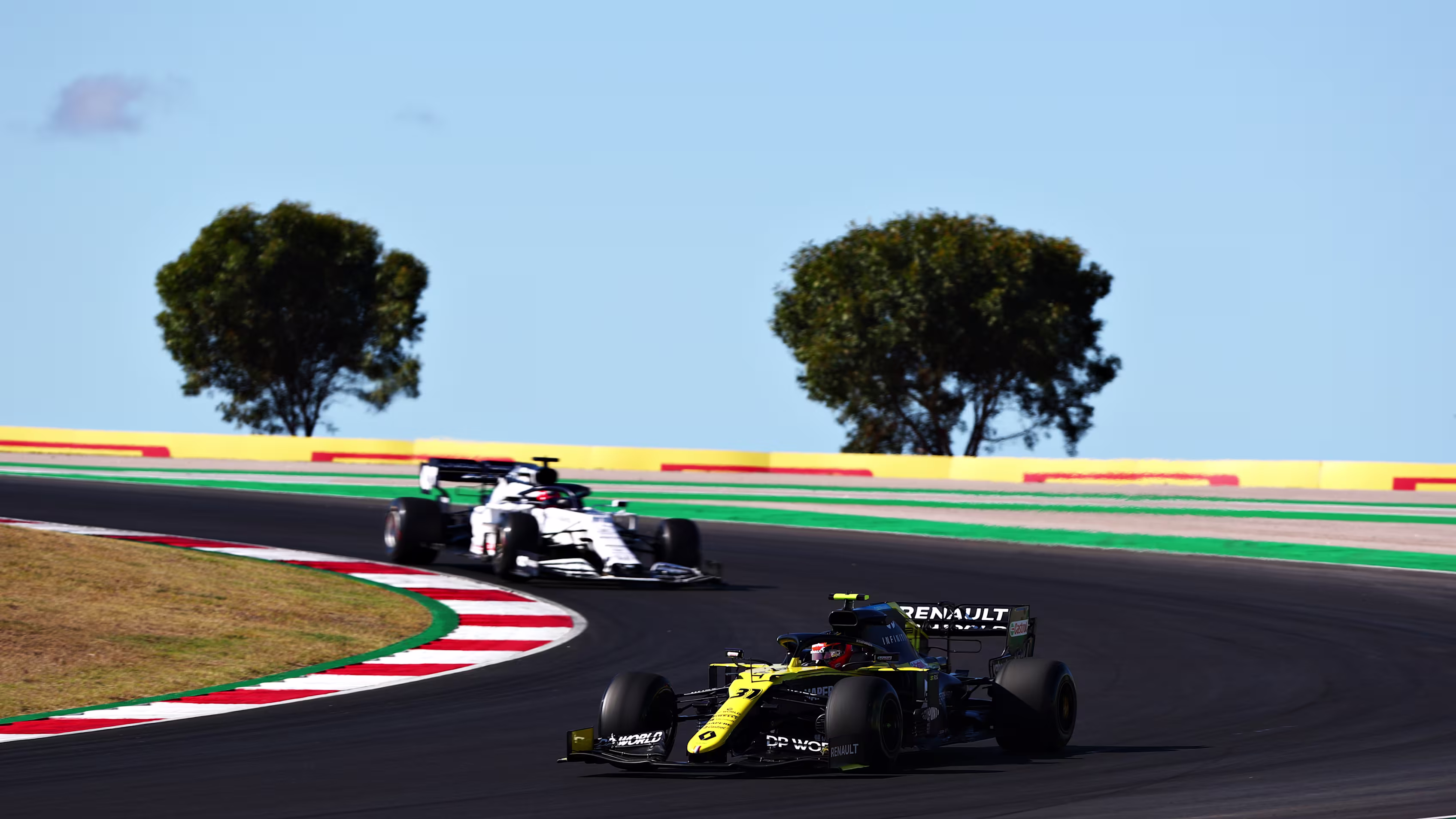 F1 cars racing on a circuit